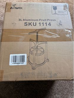 New in box aluminum fruit press