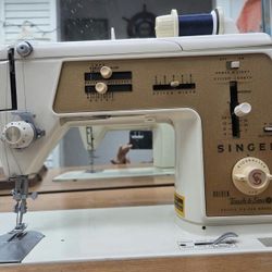 Singer Touch and Sew model 640 with original cabinet . 