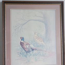 Painting with a brown frame and gold lines