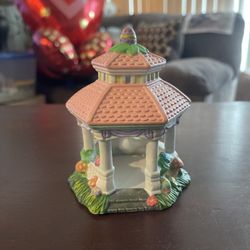 This is a Cottontale Cottages hand-painted porcelain Gazebo village accessory. It is a charming decorative piece typically used for Easter village dis