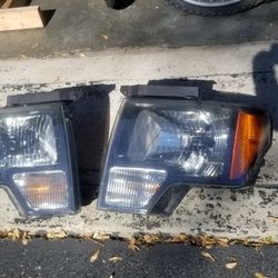 USED HEADLIGHT ASSEMBLIES FOR 2009-2014 FORD F150 (LEFT AND RIGHT)