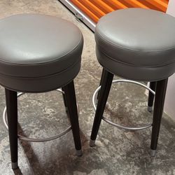 Two Gray Faux Leather Bar Stools