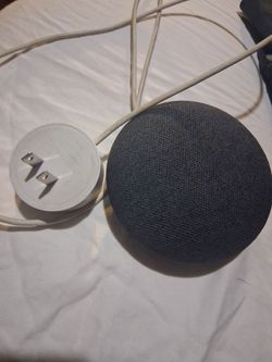 Google Nest Mini (2nd Generation) smart speaker in charcoal.