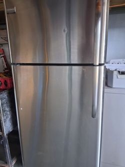 Frigidaire stainless steel top and bottom apartment size fridge fully functional