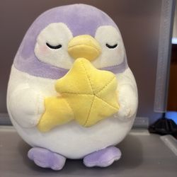 BK7552-6” purple penguin holding a yellow star