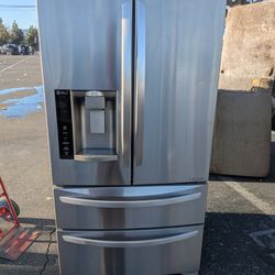 LG 4 door refrigerator/3 months of warranty and free local delivery