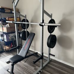Squat rack with bar and weights