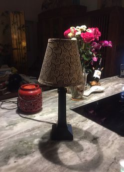 Small desk lamp with wood black base. Used only for three months. 13” high.