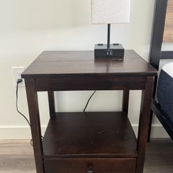 dark brown wood nightstand and lamp