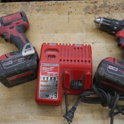 milwaukee kit drill 2702-20 and impact driver w 2 batteries and charger pre owned