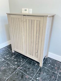 Small cabinet. Great for shoes.