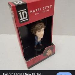 1D Harry Styles mini figure from the band One Direction.  It is a 3-inch (approx. 7.6 cm) collectible action figure.  The figure was released by Hasbr