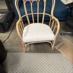 IKEA Mastholmen rattan patio chair with a white cushion