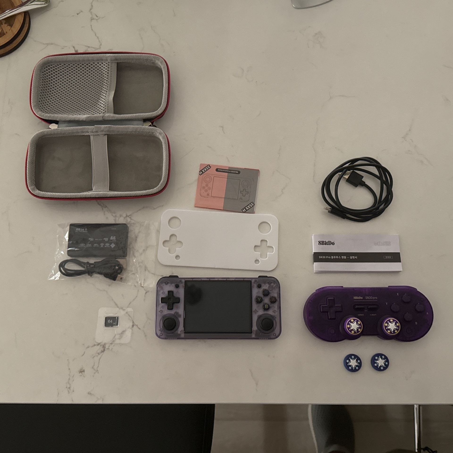 Anbernic RG35xx h purple with purple 8bitdo SN30 pro controller
