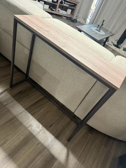 Behind couch table