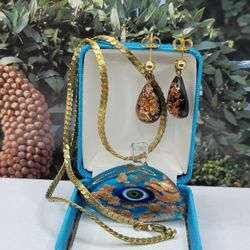 VINTAGE GLASS FRAME, EVIL EYES, & EARRINGS
