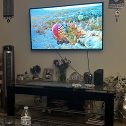 LG Tv 50 Inches Good Working Condition With A Black Tv Stand 