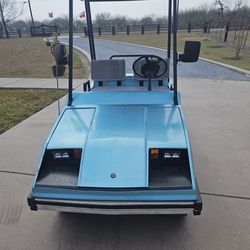 Golf &Country Western  Vintage Golf  Cart in good good condition.  It includes a horn, a cigarette lighter,  and head lights and tail lights that work