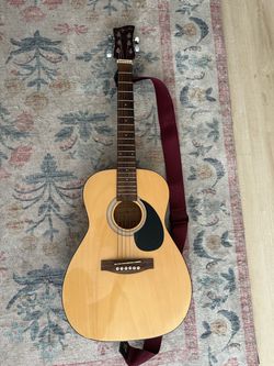 Guitar with strap