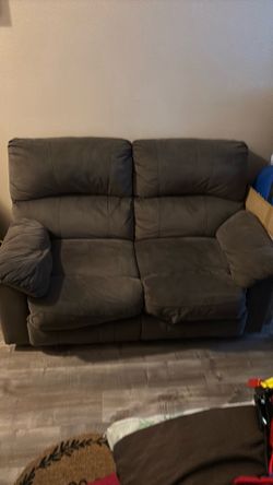Sofa Love Seat W/Reclyners o both sides.