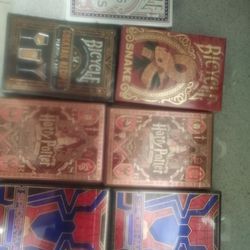 13 new unopened decks of playing cards and poker chips