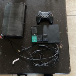 Ps2 Bundle With Wireless Controller ,two Memory Cards, A Ps1 Memory Card And Lots Of Games