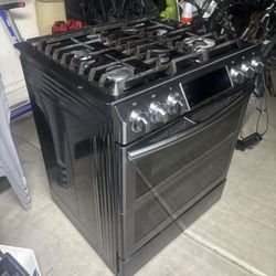 Black Stainless Steel Dishwasher And Oven Stove. 