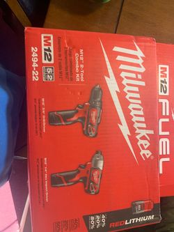 M12 set Includes two batteries and a charger and a small bag