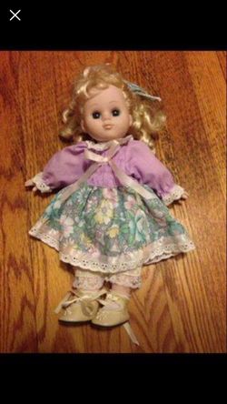 The brand Gi-Go-Toys-FTY this is a blonde hair blue eye doll, both shoes, original outfit