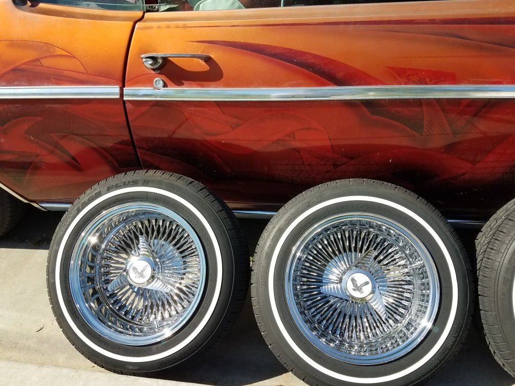 14x7 Roadster wire spokes rims lowrider white wall tires metal chips knockoffs 5 lug universal