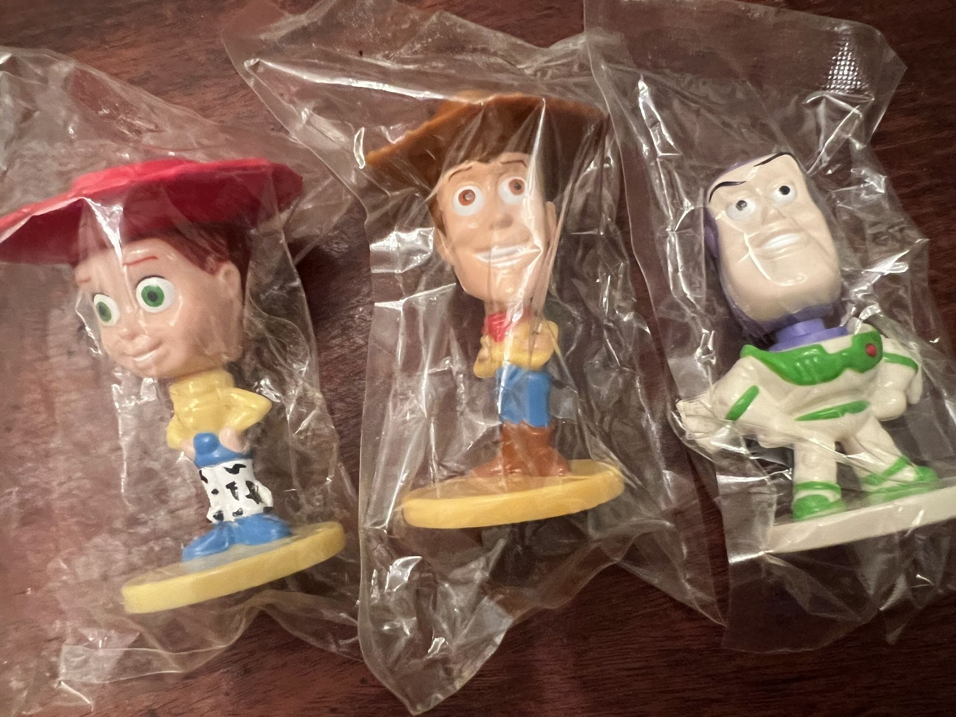 3 - 2003 KELLOGG'S Disney Pixar "Toy Story" Bobble Head Jessie, Woody & Buzz Lightyear 3 sets available $15 each set 