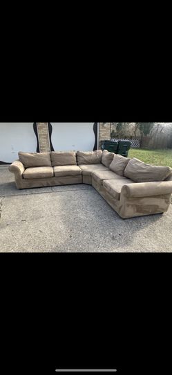 Brown 3 piece wedge sectional by Pottery Barn. 