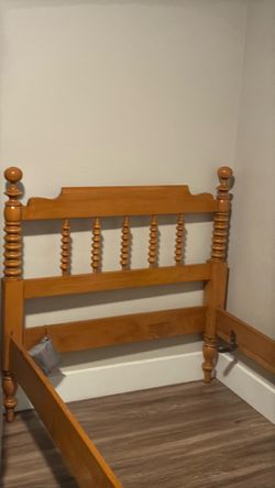 Twin-size solid wood bed frame with sealed box spring