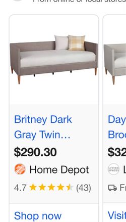Grey daybed brown chair wall art