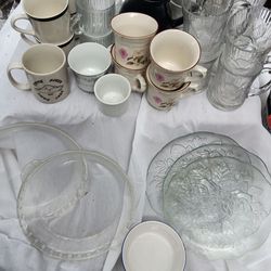 Assortment of glassware glass pie holders plates, tea pitcher and cups