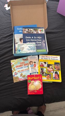 Bilingual Children's Books and Parenting Resource Bundle with a diaper bag
