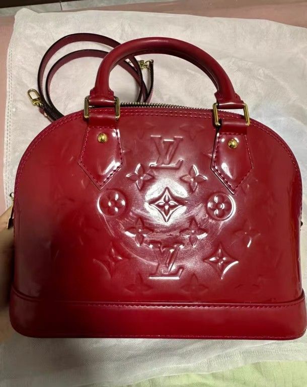 Louis Vuitton leather shell bag in red color
