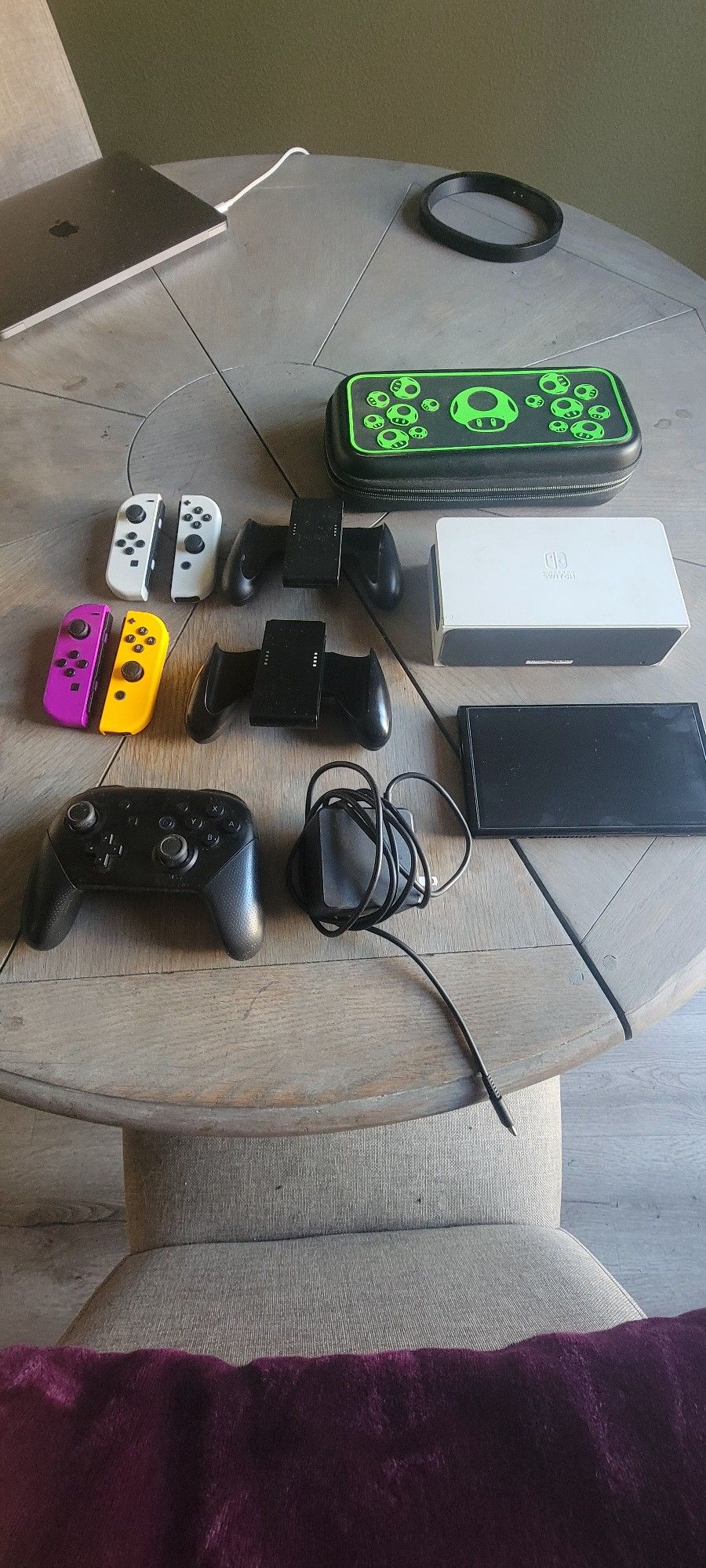 Nintendo switch (oled) with 1 joy controller, charging dock and pro controller. Carrying case included