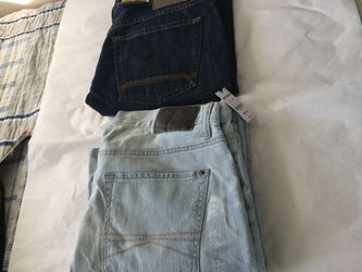 2 BRADN NEW PAIRS OF MEN JEANS One is size 34x30 timberland and one 33X30 express