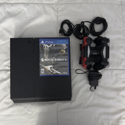 PlayStation 4 PS4 (2 working remotes & mortal kombat) includes remote charging station