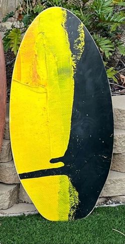 Yellow and Black Skimboard