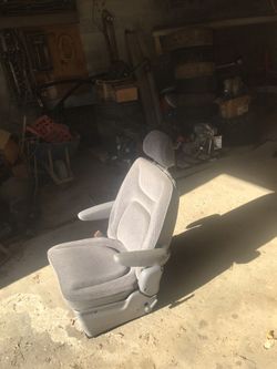 1998 Dodge caravan front driver seat or second row driver side captain seat.