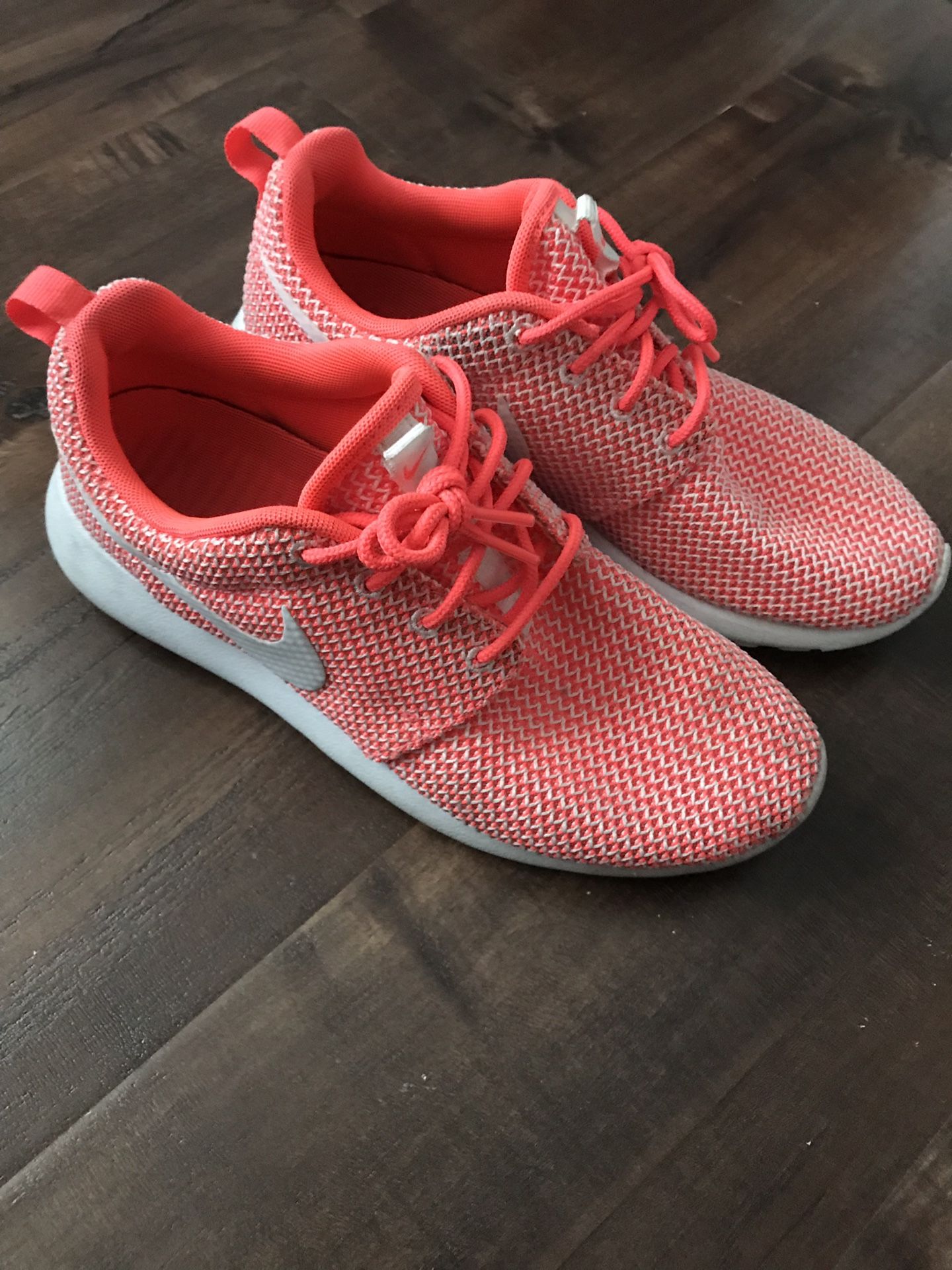 Neon pink Nike shoes