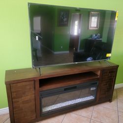 65 In. TV And Fire Place TV Stand