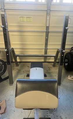 Adjustable bench with preacher curl attachment and half rack