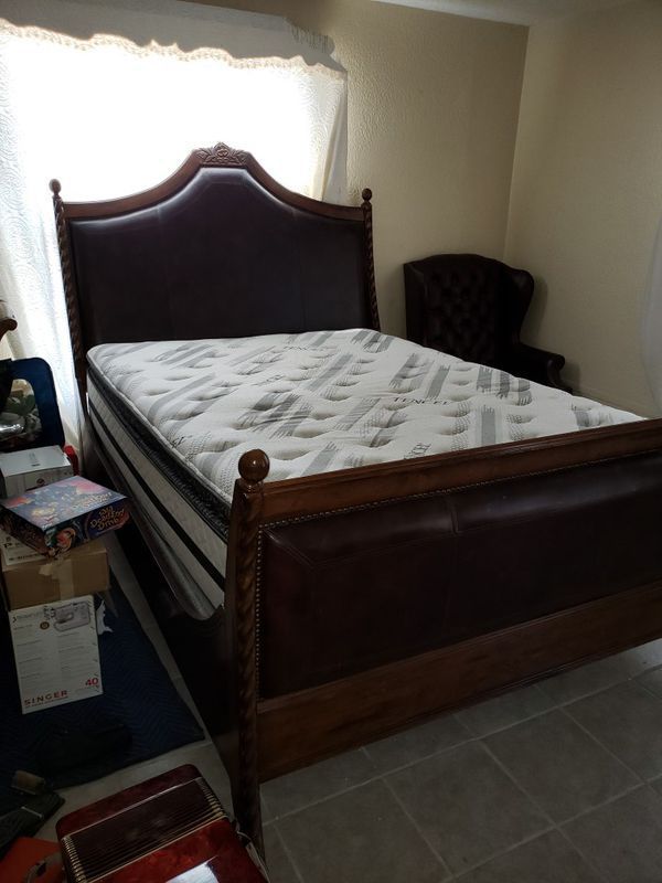 Almost new king size bed, solid wood frame with newer mattress set