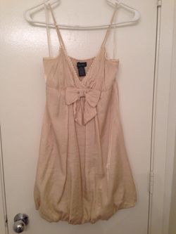 Gold bow dress size small.