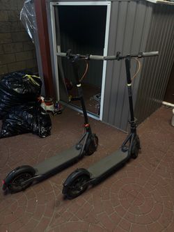 Two Black Electric Scooters NineBot