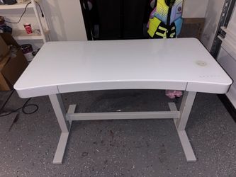 Sit/stand desk with phone charger