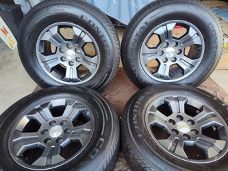 18" CHEVY WHEEL SMOKE GRAY FROM FACTORY SEMI-NEW CONTINENTAL TIRES LT
